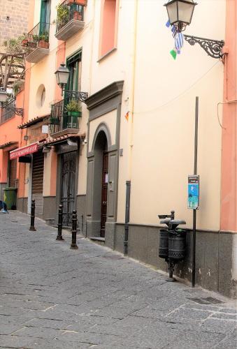 a street in a city with a street light and buildings at Doris House Sorrento in Sorrento