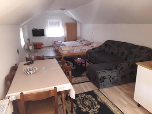 a living room with a couch and a table at Guest House Vila Banjica in Pirot