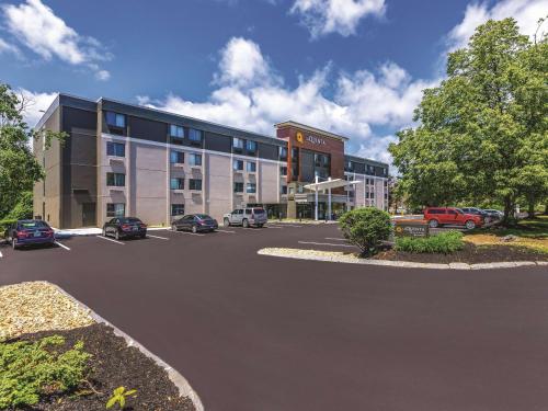 a parking lot in front of a large building at La Quinta by Wyndham Salem NH in Salem