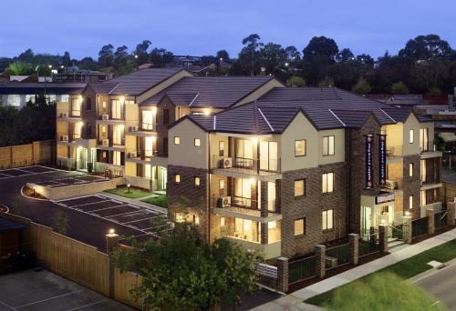 an aerial view of a large apartment building at night at Ringwood Royale in Ringwood