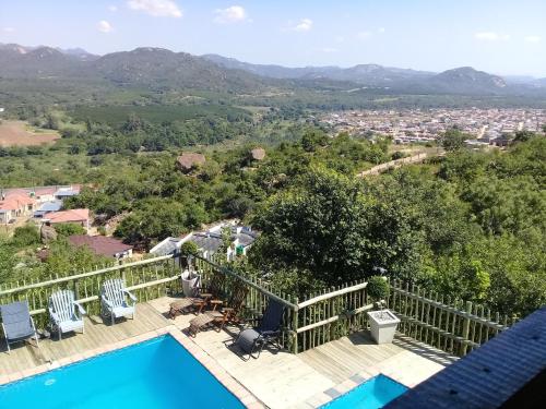 a view from the balcony of a house with a swimming pool at View Inn Exclusive Lodge in Nelspruit
