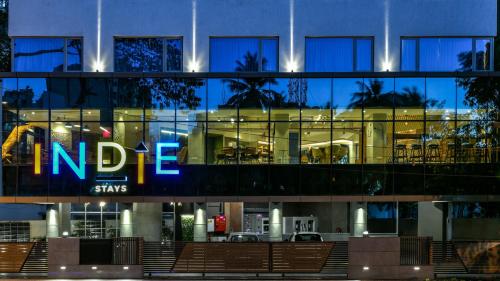 a building with a sign on the side of it at Indie Stays, BKC in Mumbai