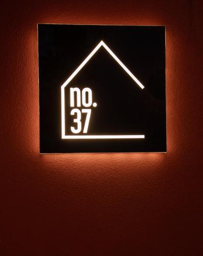 a sign with the words no on a wall at Hotel No37 in Kas