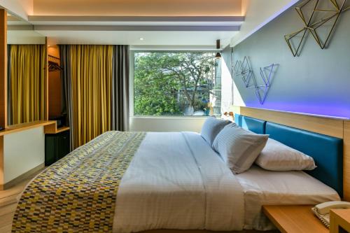 Postel nebo postele na pokoji v ubytování Indie Stays, BKC