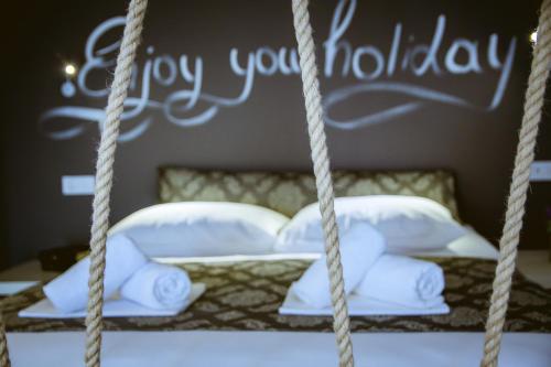 Ένα ή περισσότερα κρεβάτια σε δωμάτιο στο Gregory Comfort Hotel