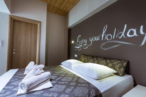 Ένα ή περισσότερα κρεβάτια σε δωμάτιο στο Gregory Comfort Hotel
