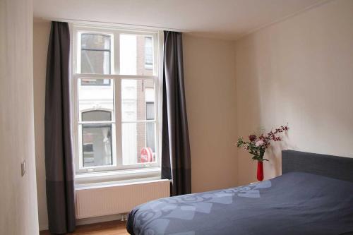 Postel nebo postele na pokoji v ubytování B&B Utrecht Domkwartier