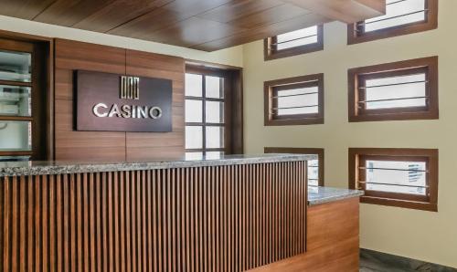 a lobby with a casoya sign on the wall at Treebo Trend Casino in Kozhikode