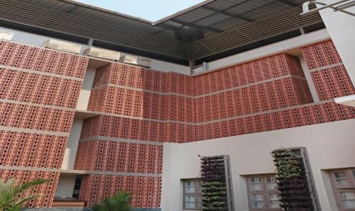 a facade of a building with red bricks at Treebo Trend Casino in Kozhikode