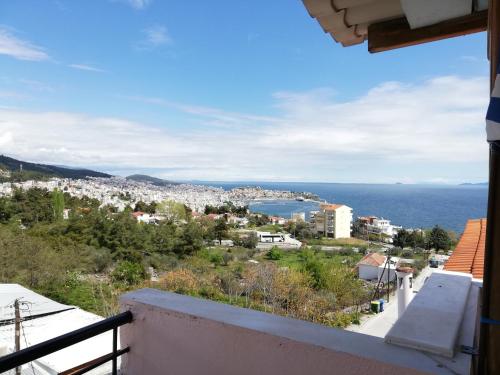 a view of a city from the balcony of a house at Aspa's Apartment in Kavala