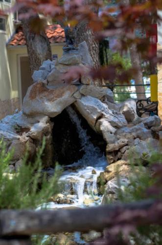 a model of a fake waterfall in a garden at Camping Stobreč Split in Split