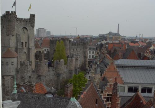 a view of a city with a castle at Hotel Gravensteen in Ghent