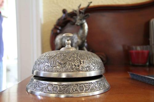 a silver bell sitting on top of a table at Craigmount in Wigtown