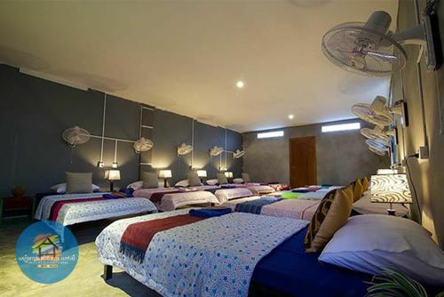 Una cama o camas en una habitación de UNCLE'S HOUSE, Siem Reap