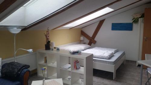 a room with a bed in a attic at Ferienwohnung Kruppa Rerik in Rerik