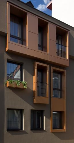 an apartment building with windows and a balcony at BOUTIQUE 25h by Eva stay 018 in Niš