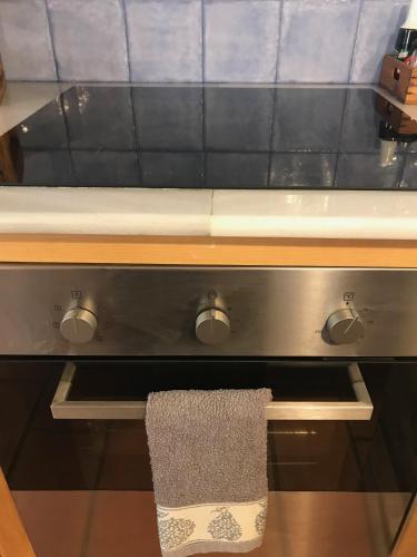 a kitchen counter with a sink with a towel on it at Casa Mingot SXVI Anciles Benasque in Anciles