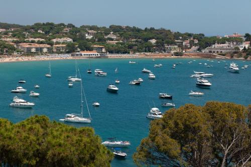 a bunch of boats in a large body of water at Alàbriga Hotel GL in S'Agaro