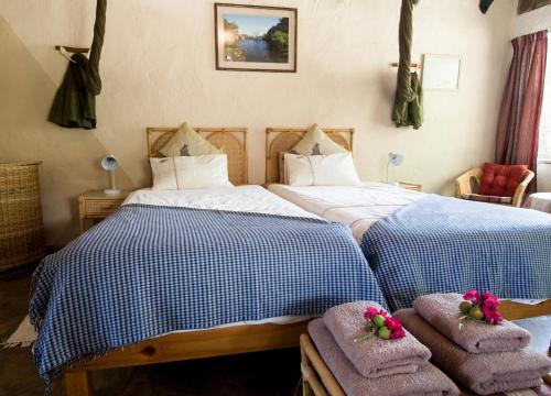 Postel nebo postele na pokoji v ubytování Etusis Lodge