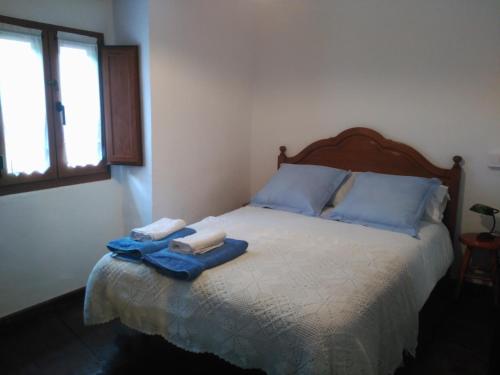 En eller flere senge i et værelse på Casa Gelina