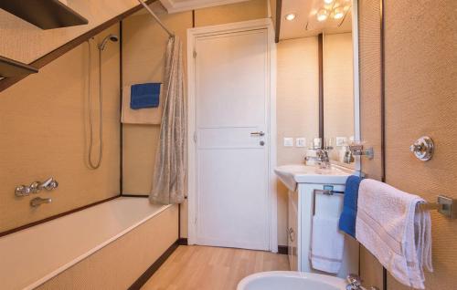 a bathroom with a sink and a toilet and a mirror at GAETA - Villa Fontania in Gaeta