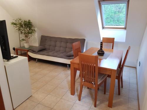 a living room with a table and a couch at Casa Monte in Bovec