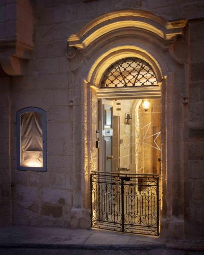 an entrance to a building with a door and a window at The 3Cities Auberge in Cospicua