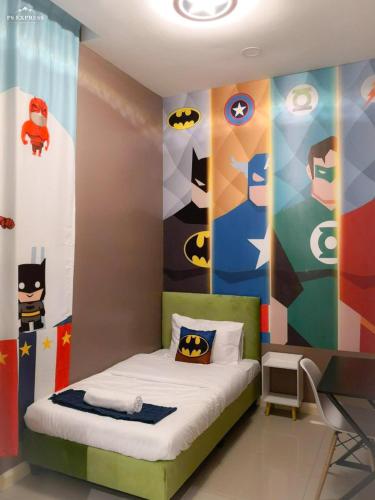 a bedroom with a batman mural on the wall at Legoland D'PRISTINE Apartment By TGP in Nusajaya