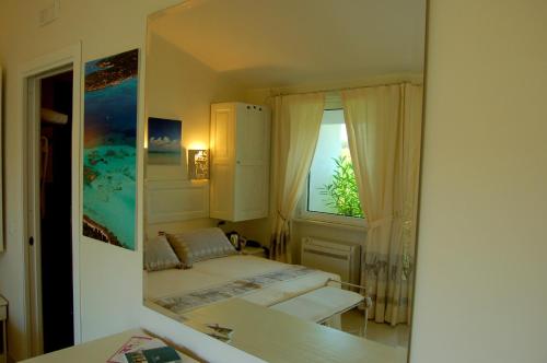 Postel nebo postele na pokoji v ubytování Hotel Budoni Beach
