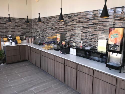 a counter in a restaurant with a brick wall at Days Inn by Wyndham Grove in Grove