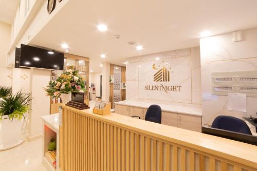 a salon with a waiting room with a reception desk at Silent Night Dem Lanh Hotel in Da Lat