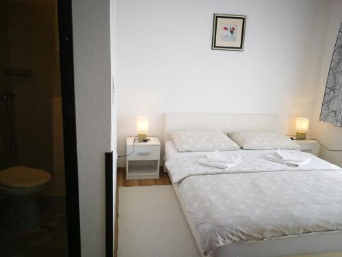 Postel nebo postele na pokoji v ubytování Apartman Marija Brajdic