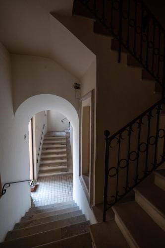 an empty stairway with a hallway with a stair case at B&B Pretoria Suite in Potenza