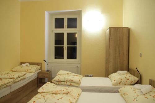 Postel nebo postele na pokoji v ubytování Penzion Daníž