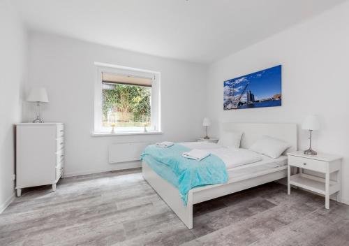Posteľ alebo postele v izbe v ubytovaní Apartament przy Bulwarze