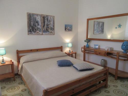 A bed or beds in a room at Villa Oltremare By Cala Salento