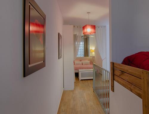 a hallway with a living room with a couch at Casas Rurales Prunus Avium in Cambrón