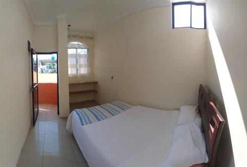 Postel nebo postele na pokoji v ubytování Hostal Duncan