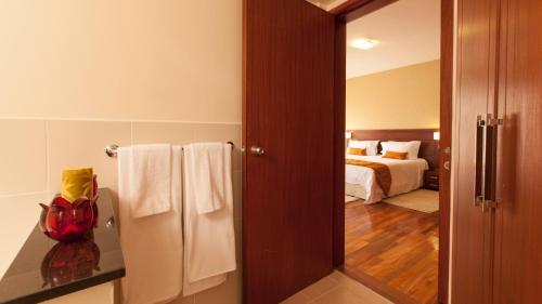 Ένα ή περισσότερα κρεβάτια σε δωμάτιο στο Waridi Paradise Hotel and Suites