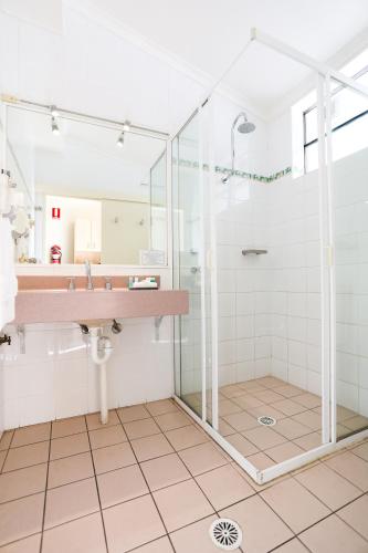 a bathroom with a shower and a sink at Parkhaven in Nowra