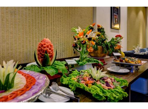 a table with several plates of food on it at Udaan Olive Hotel & Spa, Pelling in Pelling