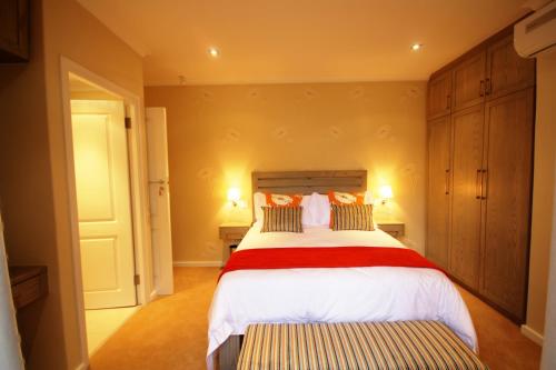 Ein Bett oder Betten in einem Zimmer der Unterkunft Gardenview Guest House