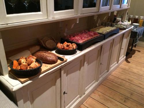 a buffet with many different types of food on it at B&B Geste d' Alice in Middelkerke