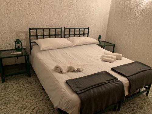 מיטה או מיטות בחדר ב-Villa Anna