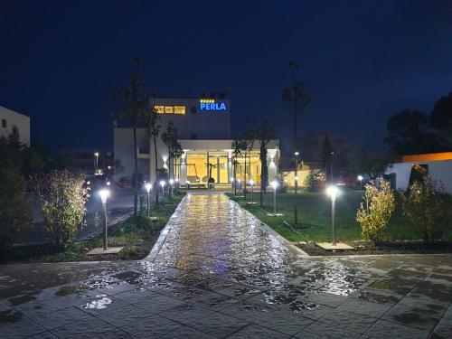 a building at night with a cobblestone street at Perla Luxury in Ulcinj