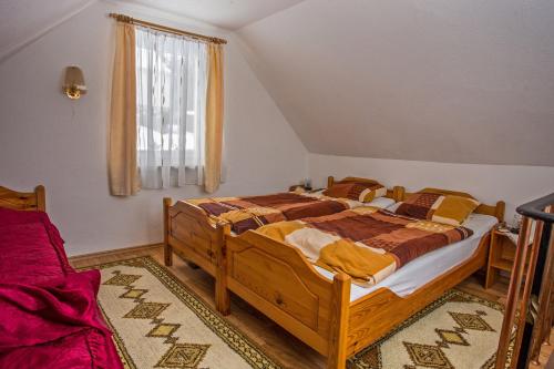 a bedroom with two beds and a window at Ferienhaus Gläser in Bockau