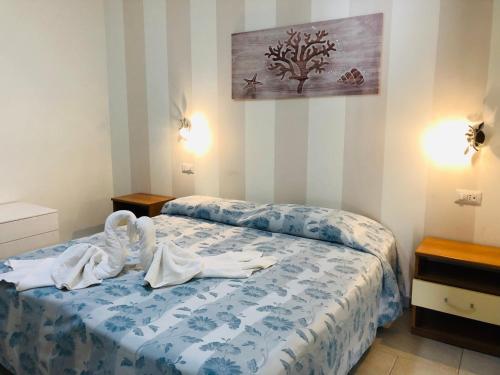 Katil atau katil-katil dalam bilik di Hotel La Rosetta Scauri