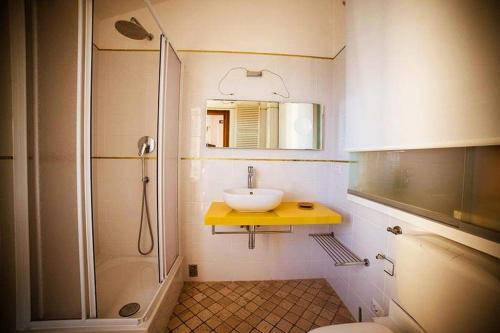 a bathroom with a sink and a shower at Camere Nicolina in Vernazza