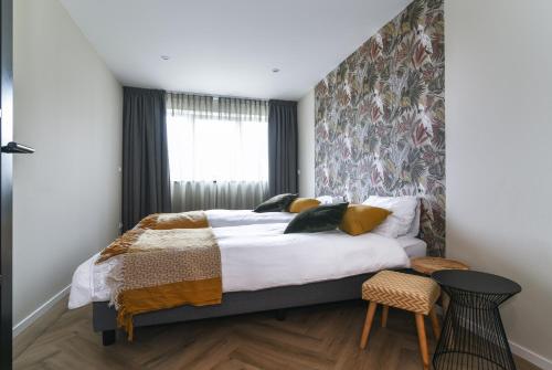 Katil atau katil-katil dalam bilik di Luxe bosvilla De Paradijsvogel