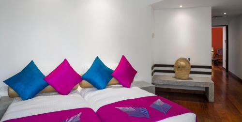 a bed room with a white bedspread and pillows at Royal Palms Beach Hotel in Kalutara